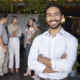 A smiling entrepreneur just like you as you're preparing to sell your business.