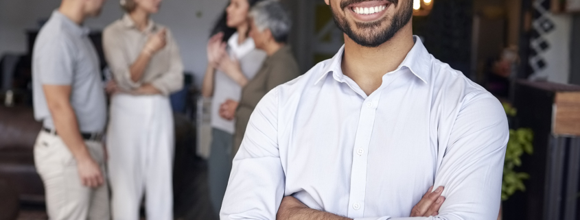 A smiling entrepreneur just like you as you're preparing to sell your business.